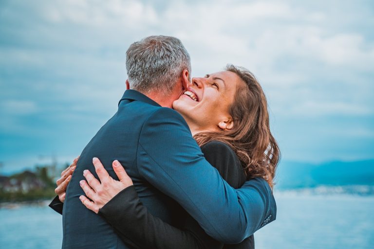 a couple hugging and laughing